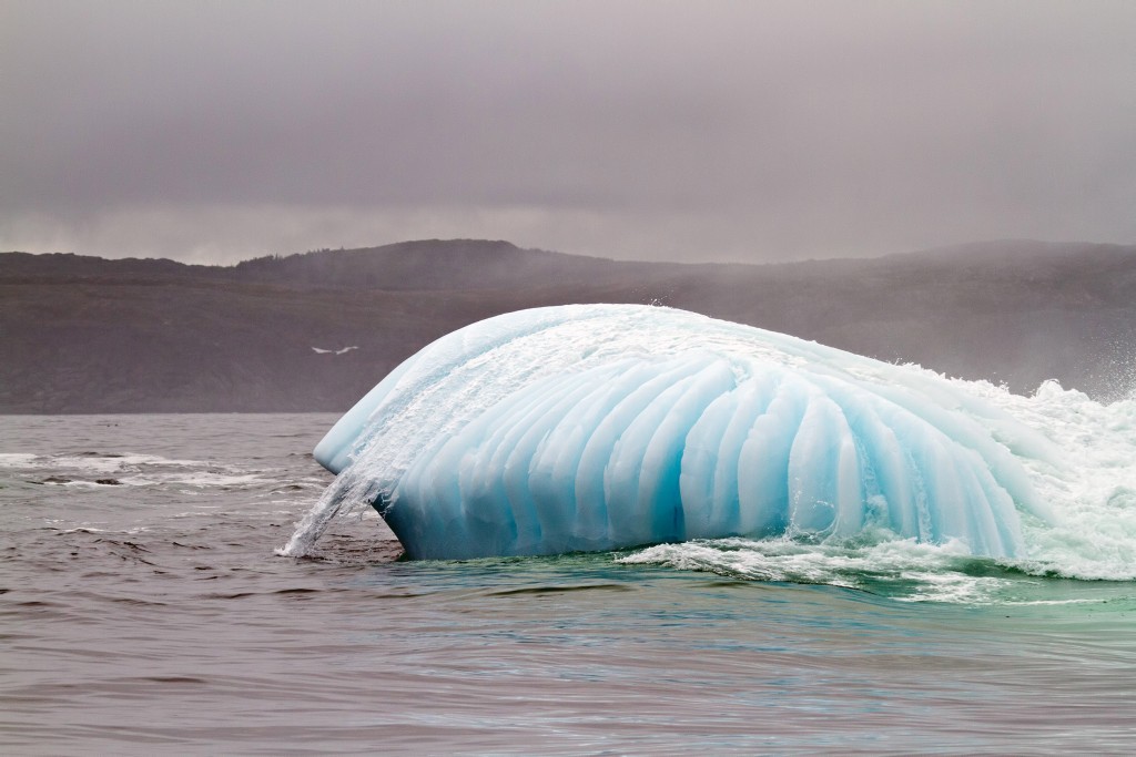 Iceberg with water flowing over.